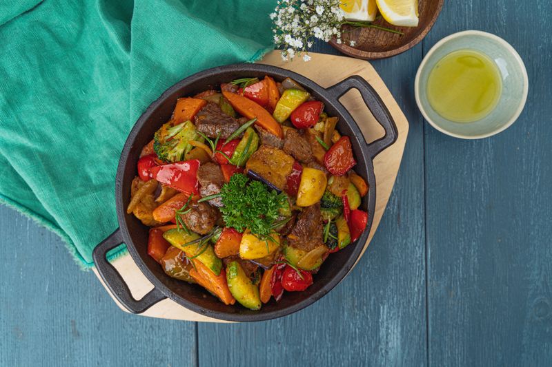 Chuys beef fajitas sizzling on cast iron skillet